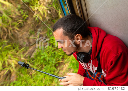 Travel by train in Sri Lanka. A very slow train with no doors. Picturesque places of the island Travel by train in Sri Lanka. A very slow train with no doors. Picturesque places of the island 81979482