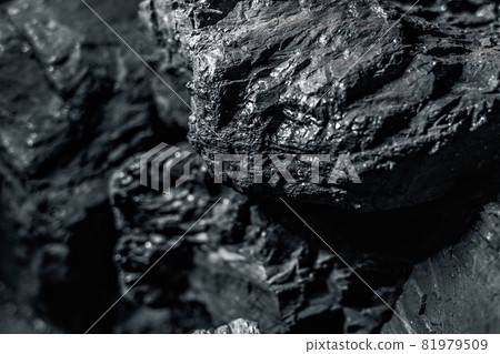 Black coal stones close-up. Solid advertising background. Black coal stones close-up. Solid advertising background. 81979509