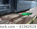 Cleaning before painting the wood deck 81982628
