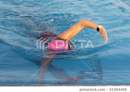 Female swimming in a pool close up Female swimming in a pool close up 81984406