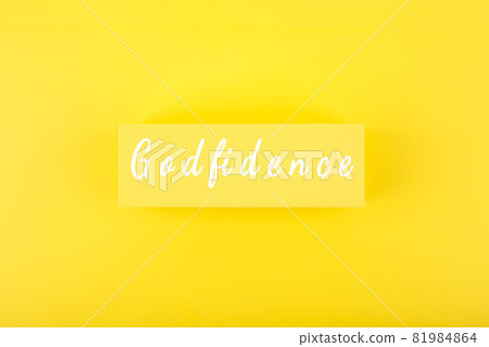 Godfidence single word against bright yellow background Godfidence single word against bright yellow background 81984864