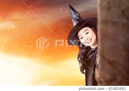 Asian witch woman with a hat standing Asian witch woman with a hat standing 81985691