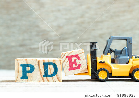 Toy forklift hold letter block e to complete word PDE (abbreviation of permitted daily exposure, partial differential equation or personal development education) on wood background Toy forklift hold letter block e to complete word PDE (abbreviation of permitted daily exposure, partial differential equation or personal development education) on wood background 81985923