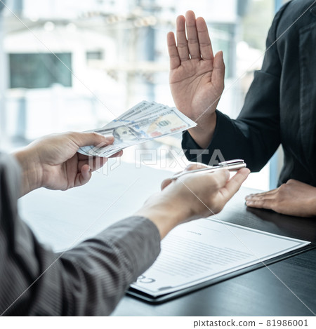 Close up of man employee offering bribe money and pen to businessman to signing the contract to joint engage Close up of man employee offering bribe money and pen to businessman to signing the contract to joint engage 81986001
