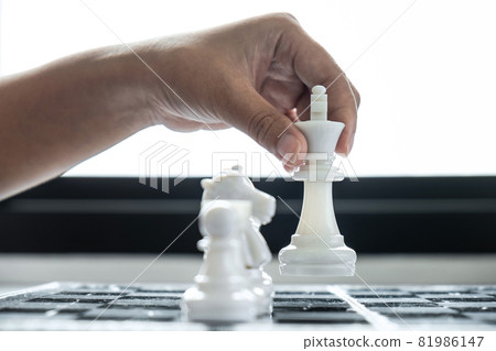 Woman playing chess and thinking strategy plan about crash overthrow the opposite team and development analyze for successful Woman playing chess and thinking strategy plan about crash overthrow the opposite team and development analyze for successful 81986147