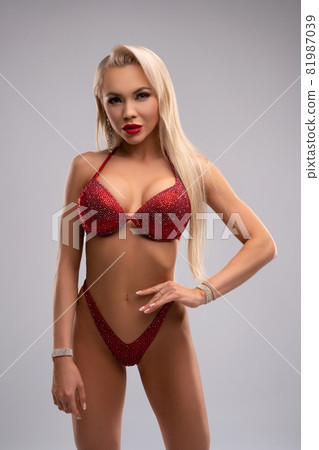 Alluring woman in red underwear in studio Alluring woman in red underwear in studio 81987039