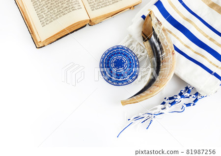 Yom kippur, Rosh hashanah, jewish New Year holiday, concept. Religion image of shofar - horn on white prayer talit. Yom kippur, Rosh hashanah, jewish New Year holiday, concept. Religion image of shofar - horn on white prayer talit. 81987256