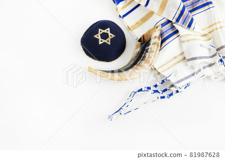 Yom kippur, Rosh hashanah, jewish New Year holiday, concept. Religion image of shofar - horn on white prayer talit. Yom kippur, Rosh hashanah, jewish New Year holiday, concept. Religion image of shofar - horn on white prayer talit. 81987628