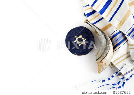 Yom kippur, Rosh hashanah, jewish New Year holiday, concept. Religion image of shofar - horn on white prayer talit. Yom kippur, Rosh hashanah, jewish New Year holiday, concept. Religion image of shofar - horn on white prayer talit. 81987632