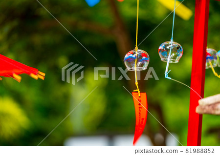 Summer tradition A cool wind chime swaying in the wind Summer tradition A cool wind chime swaying in the wind 81988852
