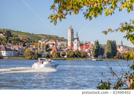 Panorama of Krems town with speed boat during summer time on Danube river in Wachau valley, Lower Austria, Austria Panorama of Krems town with speed boat during summer time on Danube river in Wachau valley, Lower Austria, Austria 81990402
