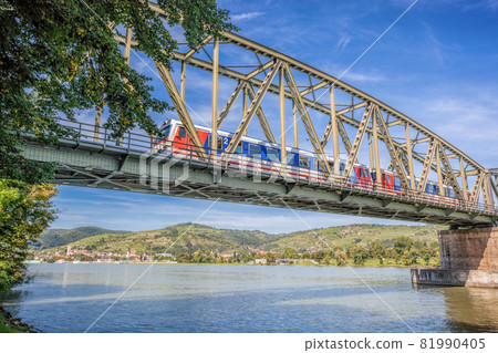 Train on bridge against Krems town in Wachau valley, Unesco world heritage site in Lower Austria, Austria Train on bridge against Krems town in Wachau valley, Unesco world heritage site in Lower Austria, Austria 81990405