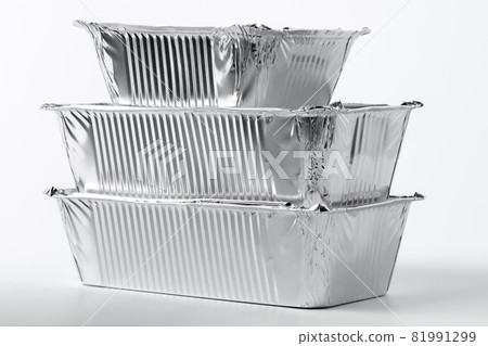 Takeaway meal in foil food box on white background Takeaway meal in foil food box on white background 81991299