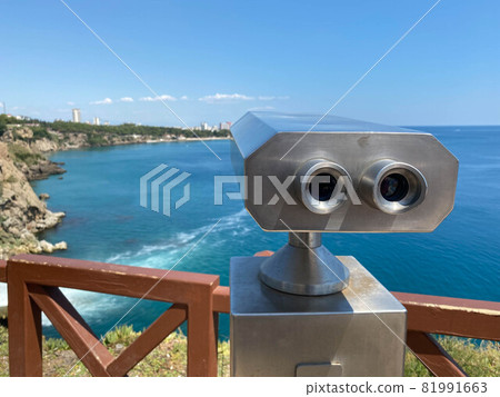Journey white binoculars telescope on observation deck for tourist viewing sea attractions Journey white binoculars telescope on observation deck for tourist viewing sea attractions 81991663