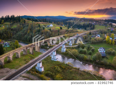 Beautiful old viaduct at sunset in carpathian mountains in autumn 81992746