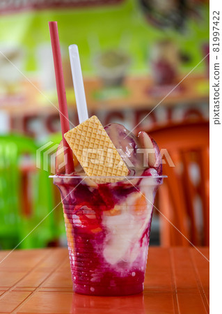 Traditional sweet water ice with fruits called cholado in the city of Cali in Colombia Traditional sweet water ice with fruits called cholado in the city of Cali in Colombia 81997422