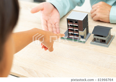 Man and house in work clothes 81998764
