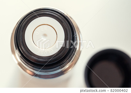 Close up of a thermos flask in a daylight 82000402