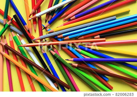 Colored pencils on a colored background. A set of pencils for drawing. Background from pencils. 82006283