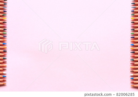 Colored pencils on a colored background. A set of pencils for drawing. Background from pencils. 82006285