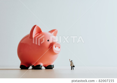 Lonely businessman and Piggy Bank. Business concept 82007155