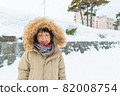 Cute asian boy in snow 82008754