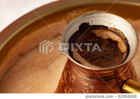 Copper turk with coffee brewing in sand Copper turk with coffee brewing in sand 82008888