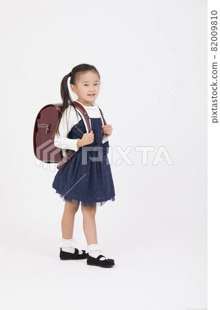 Girl in a school bag 82009810