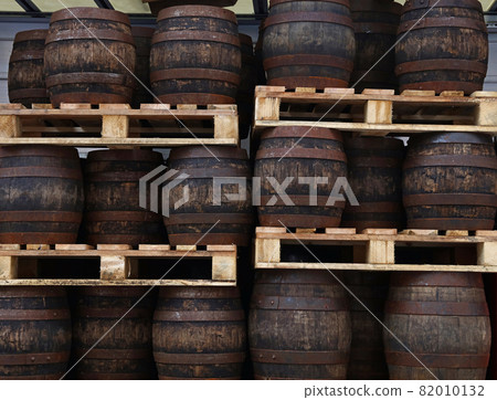 Pallets with vintage oak barrels of craft beer Pallets with vintage oak barrels of craft beer 82010132