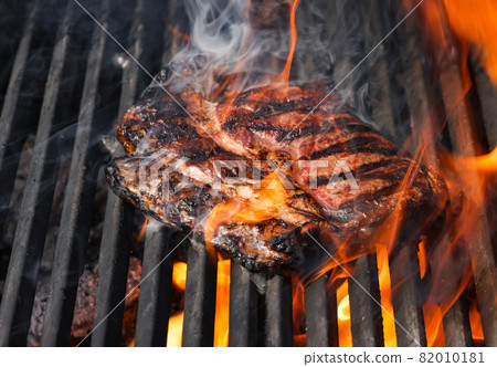 Searing and smoking ribeye steaks on grill Searing and smoking ribeye steaks on grill 82010181