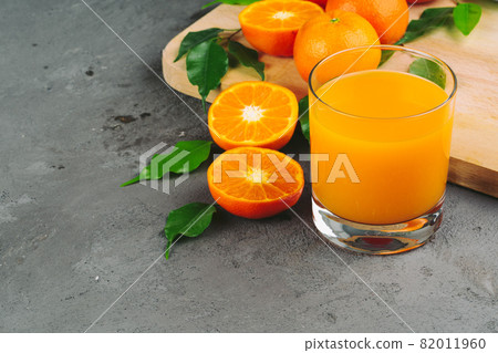Still life of orange juice close up 82011960