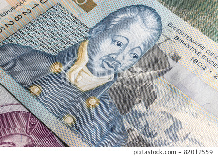 Close up to Gourde or Gourdes of the Republic of Haiti. Paper banknotes of the Caribbean country. Detailed capture of the front art design. Detailed money background wallpaper. Currency bank note Close up to Gourde or Gourdes of the Republic of Haiti. Paper banknotes of the Caribbean country. Detailed capture of the front art design. Detailed money background wallpaper. Currency bank note 82012559