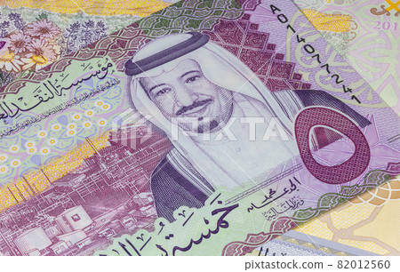 Close up photography of Saudi Arabian money. Paper Currency of Saudi Arabia. Saudi Riyal with the portrait of King Salman. Monetary Authority unveiled new family of banknotes. Detailed design capture Close up photography of Saudi Arabian money. Paper Currency of Saudi Arabia. Saudi Riyal with the portrait of King Salman. Monetary Authority unveiled new family of banknotes. Detailed design capture 82012560