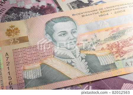 Close up to Gourde or Gourdes of the Republic of Haiti. Paper banknotes of the Caribbean country. Detailed capture of the front art design. Detailed money background wallpaper. Currency bank note 82012563