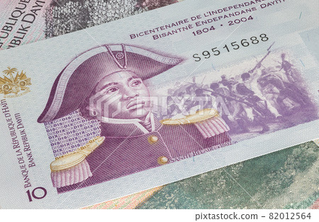 Close up to Gourde or Gourdes of the Republic of Haiti. Paper banknotes of the Caribbean country. Detailed capture of the front art design. Detailed money background wallpaper. Currency bank note 82012564