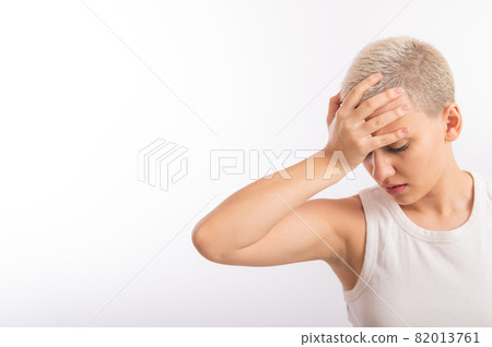 Young caucasian woman with short hair with a palm on her face on a white background. 82013761