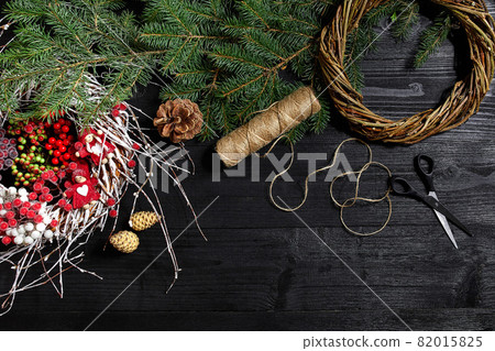 Manufacturer of Christmas decor with their own hands. Christmas wreath for the holiday. The new year celebration. Top view 82015825