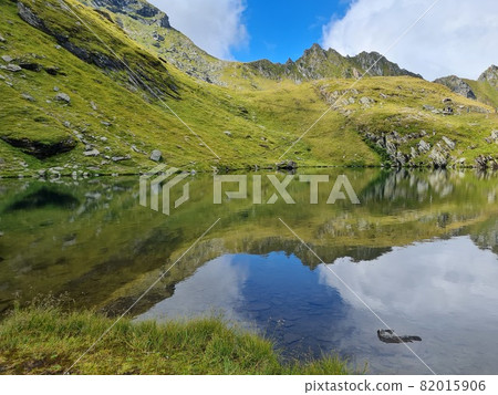 mountain and sky reflection on steel lake balea water mountain and sky reflection on steel lake balea water 82015906