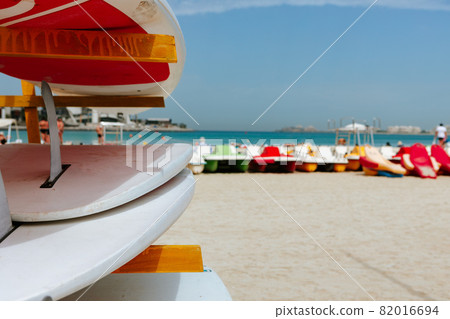 Surfboards stacked on the rack on a beach Surfboards stacked on the rack on a beach 82016694