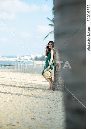 Young woman on sandy beach Young woman on sandy beach 82016731