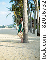 Young woman on sandy beach 82016732