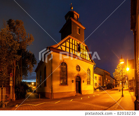 View of the historic protestant church of Walldorf in hesse during sunset View of the historic protestant church of Walldorf in hesse during sunset 82018210
