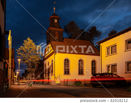View of the historic protestant church of Walldorf in hesse during sunset View of the historic protestant church of Walldorf in hesse during sunset 82018212