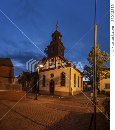View of the historic protestant church of Walldorf in hesse during sunset View of the historic protestant church of Walldorf in hesse during sunset 82018216