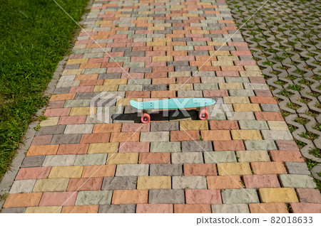 Close-up of a penny board outdoors on a warm summer day. 82018633