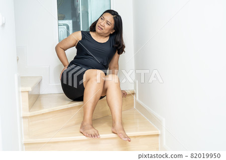 Asian middle-aged lady woman patient fall down the stairs because slippery surfaces 82019950
