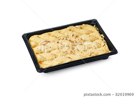 Black plastic box of Turkish halva dessert isolated on white Black plastic box of Turkish halva dessert isolated on white 82019969
