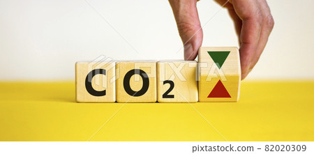 CO2 changes symbol. Concept words 'CO2' on cubes on a beautiful yellow table, white background. Business and CO2 changes concept. Copy space. CO2 changes symbol. Concept words 'CO2' on cubes on a beautiful yellow table, white background. Business and CO2 changes concept. Copy space. 82020309