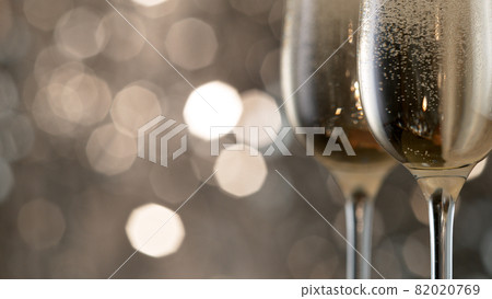 Champagne bubbles in glass flutes. 82020769