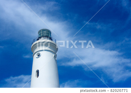 White Lighthouse Tower With Cloudy Blue Sky 82020771